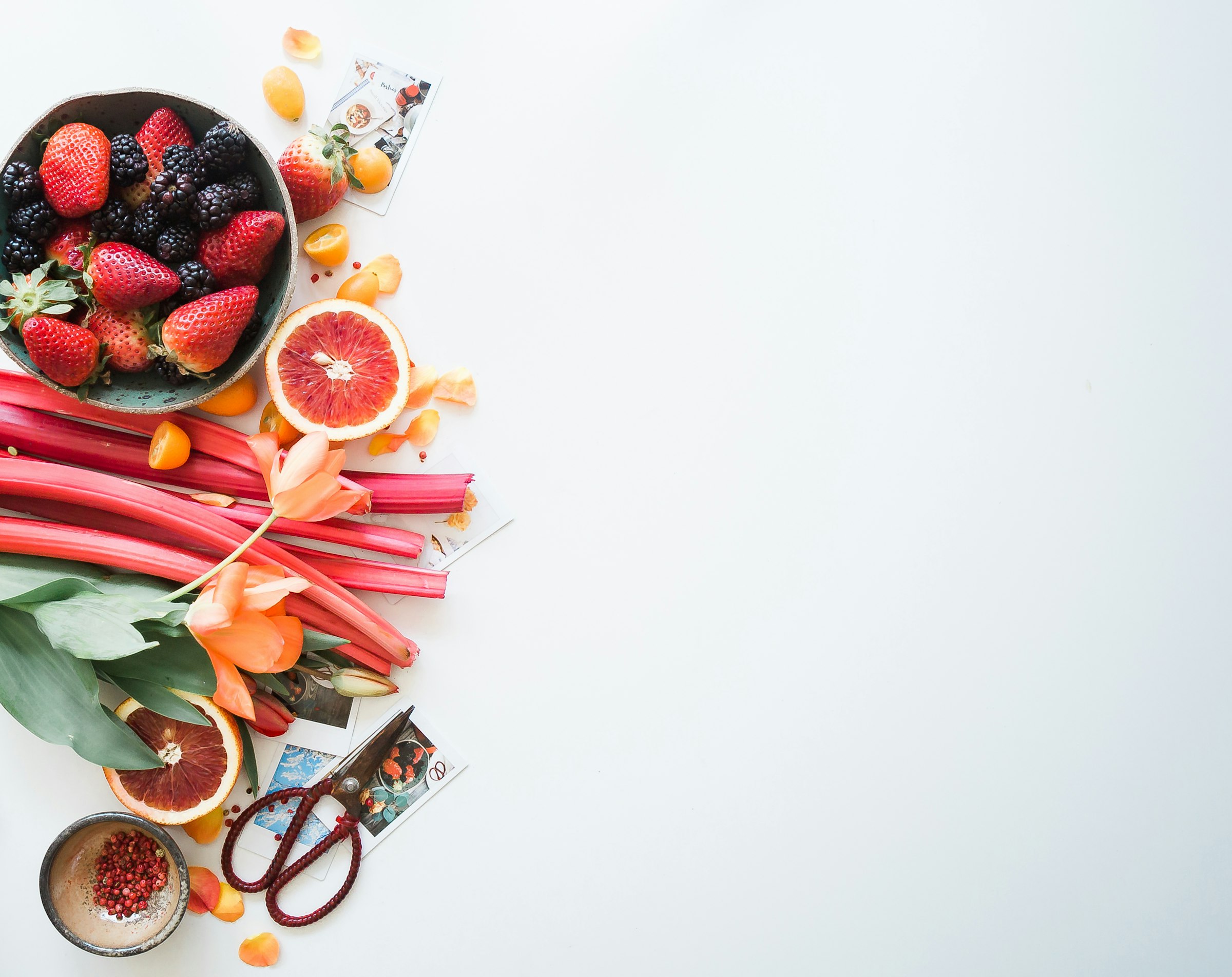 Rhubarb and fresh fruit spread on a surface